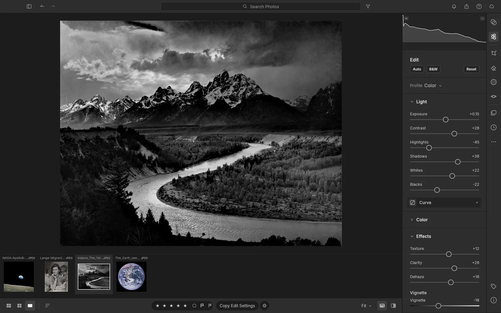 LightCraft developing a black-and-white landscape photo of the Tetons with a filmstrip and adjustment sliders